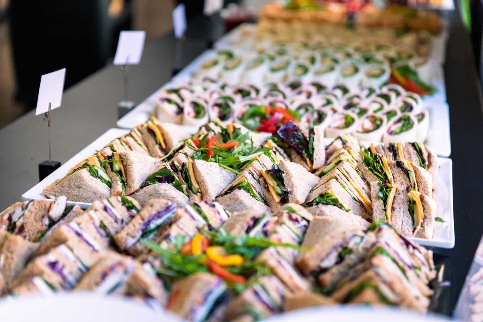 corporate lunch catering with elegant boxed lunches and branded napkins, professional food photography